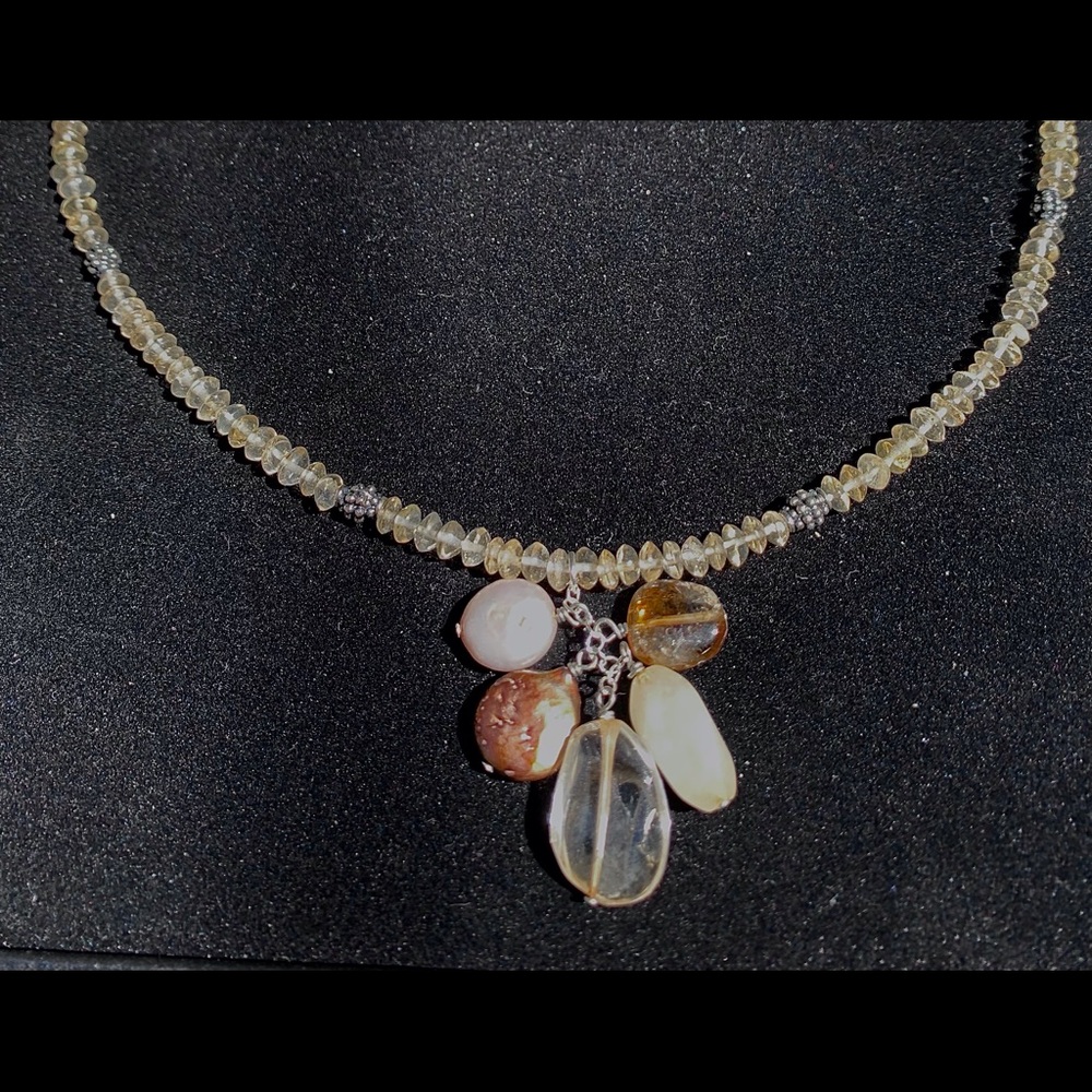 Light amber colored crystal necklace with drop accents.